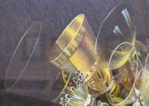 A close-up of a still life by Margaret Lee. Look at the exquisite stitch quality on the glass ware